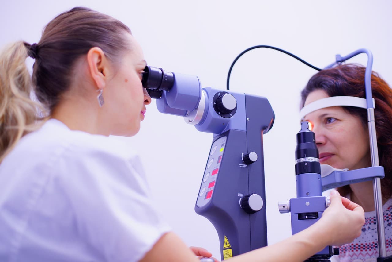 Patient and doctor making a comprehensive adult eye and vision examination