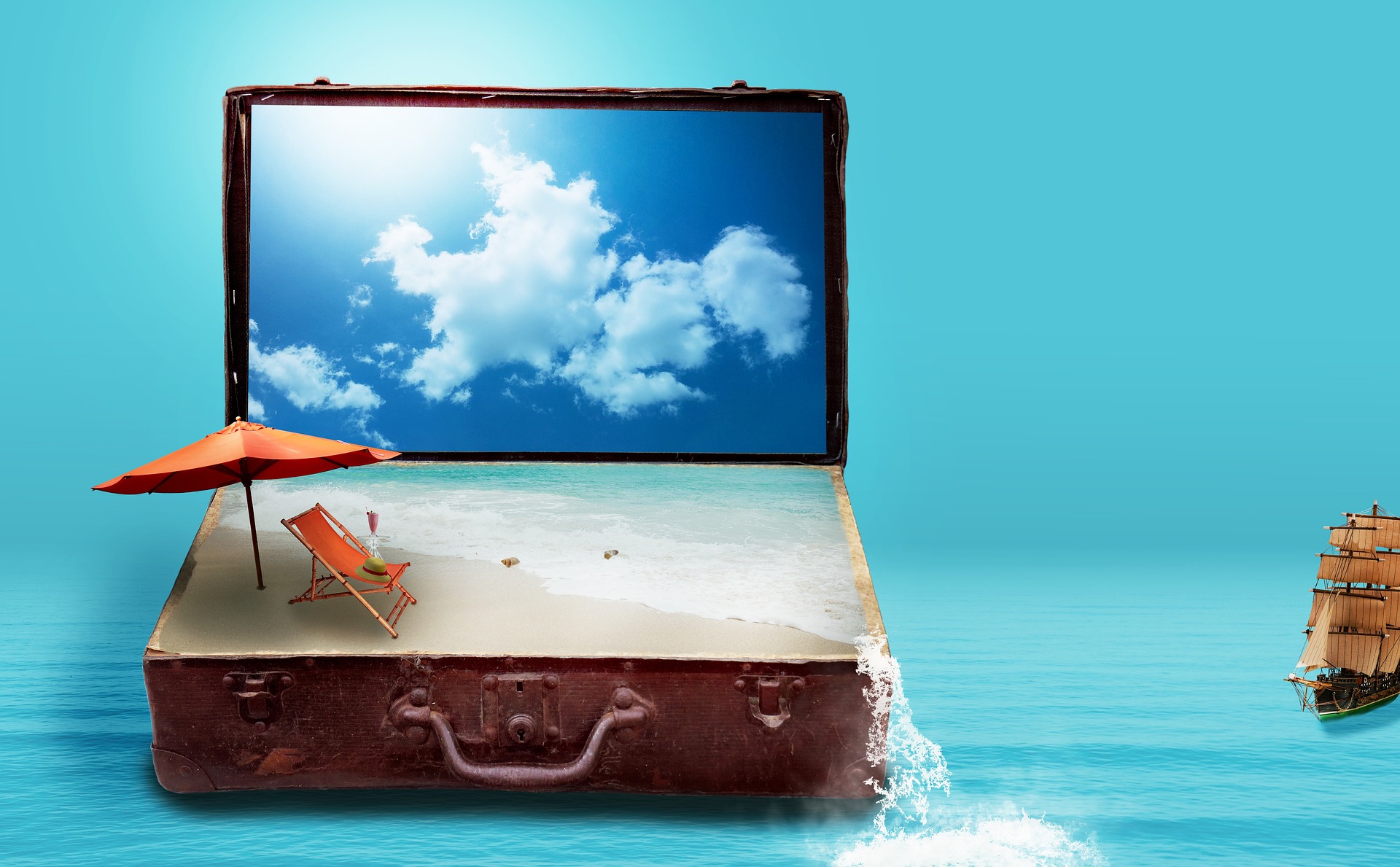 An old, open briefcase with a mini beach and sun in it