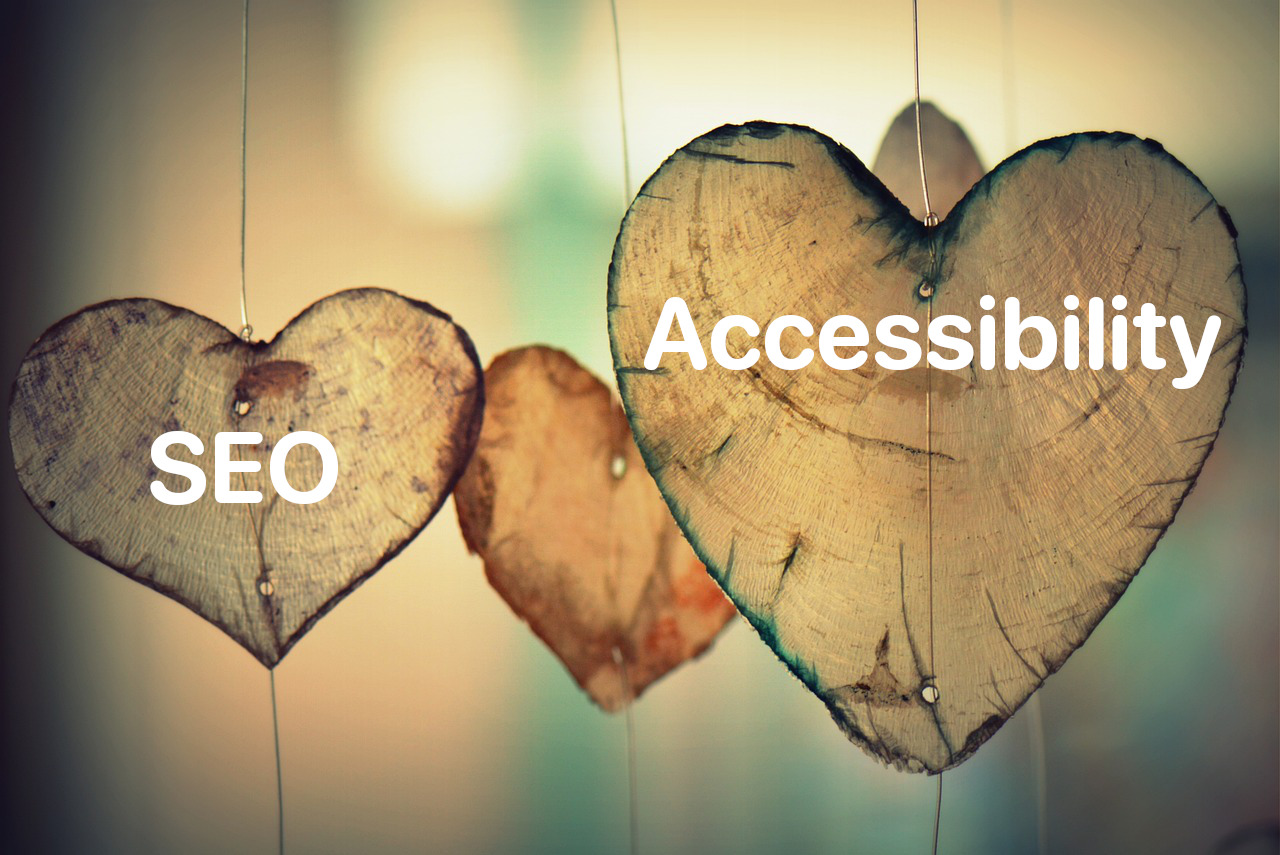 Two wooden hearts with the words: SEO and Accessibility